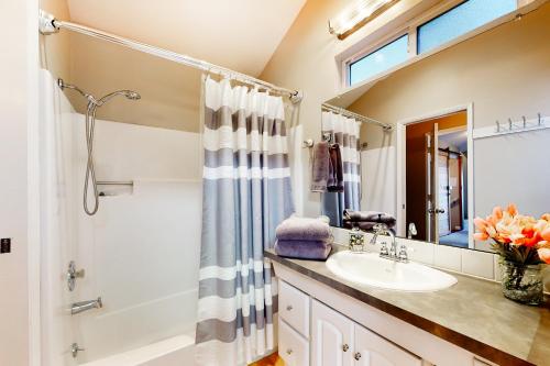 a bathroom with a sink and a shower at Flat on 41st in Portland