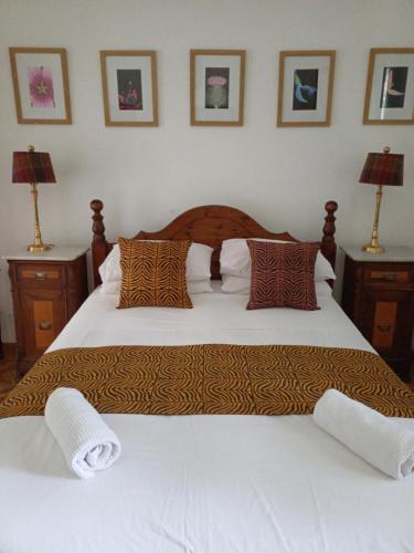 a bedroom with two beds with pillows and two lamps at Villamonestevole501 in Umbertide
