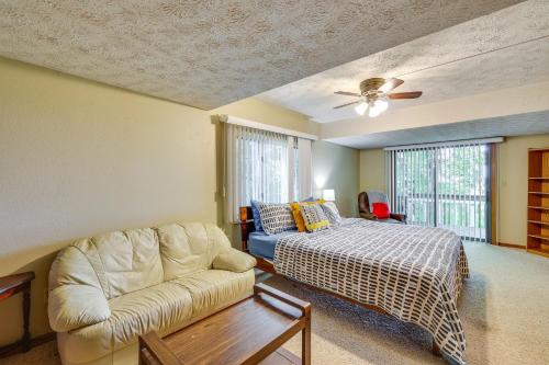 a living room with a bed and a couch at Hot Tub at Mountain-View Ozarks Retreat! in Holiday Island