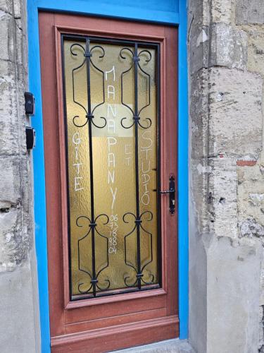 a door with a sign on top of it at Studio in Fains-les-Sources