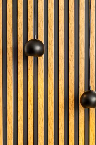 a close up of a keyboard with black knobs at K&D Central Suite in Sitia
