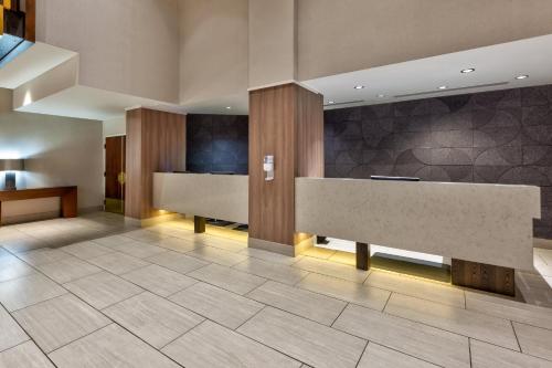 a lobby with a reception desk in a building at Crowne Plaza Dulles Airport by IHG in Herndon