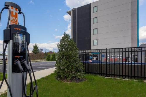 a gas pump in front of a building at Tru By Hilton Ashland, Va in Ashland