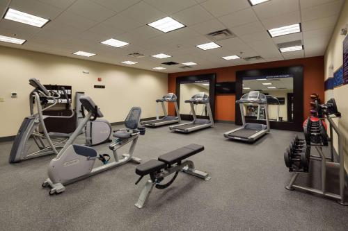 a gym with several treadmills and elliptical machines at Hampton Inn Morristown, I-81, TN in Morristown