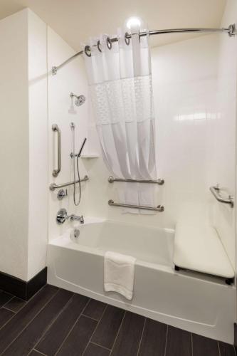 a white bathroom with a tub and a shower at Hampton Inn Morristown, I-81, TN in Morristown