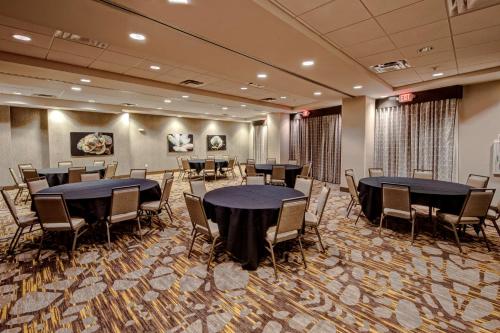 a conference room with tables and chairs in it at Hampton Inn & Suites San Jose Airport in San Jose