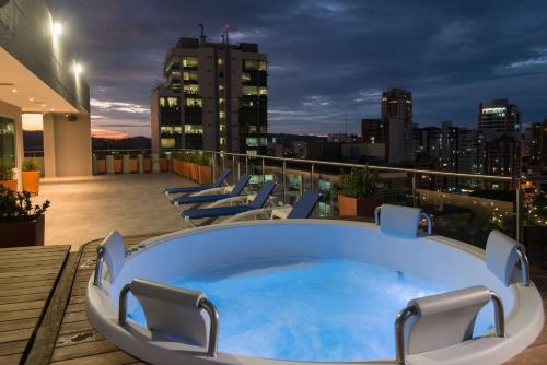 a hot tub on the roof of a building at Hampton By Hilton Bucaramanga in Bucaramanga