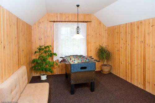 a room with a chess table and a window at Pension Modrá Hvězda in Dolní Malá Úpa