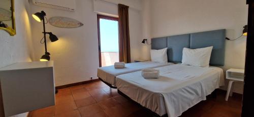 Postel nebo postele na pokoji v ubytování Estrela do Mar - A903