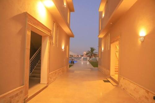an empty hallway of a building with a street at Royal Nile Villa - Nile View Apartment 1 in Luxor