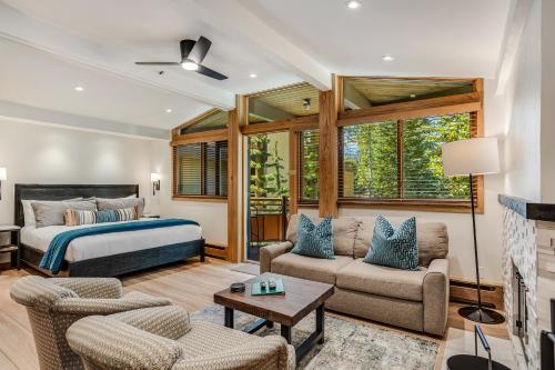 a bedroom with a bed and a living room at Laurelwood Condominiums 211 in Snowmass Village