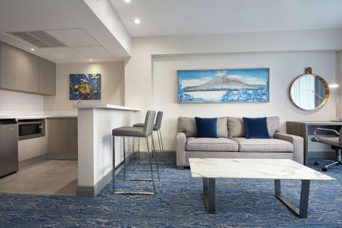 a living room with a couch and a table at DoubleTree by Hilton Managua in Managua