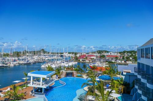 a view of a marina with boats in the water at Harbor Club St Lucia, Curio Collection by Hilton in Gros Islet