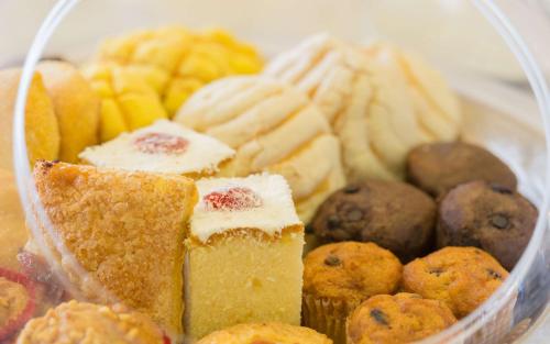 a plastic container filled with different types of pastries at Hampton Inn By Hilton Tijuana in Tijuana