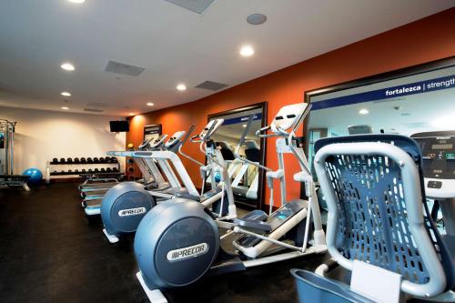 a gym with several tread machines in a room at Hampton Inn by Hilton Leon in León
