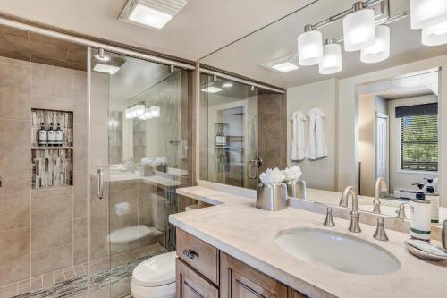 a bathroom with a sink and a shower and a toilet at Interlude Condominiums 3-Bedroom Unit 308 in Snowmass Village