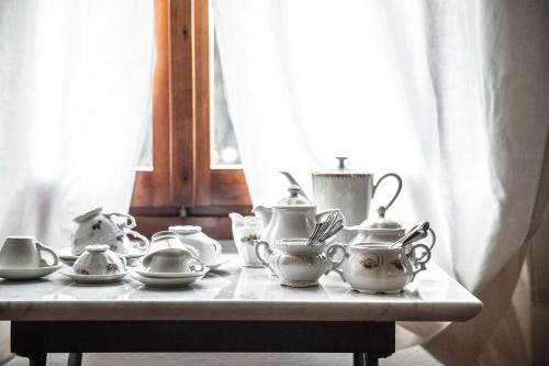 a tea set on a table in front of a window at Ca' De Memi in Piombino Dese