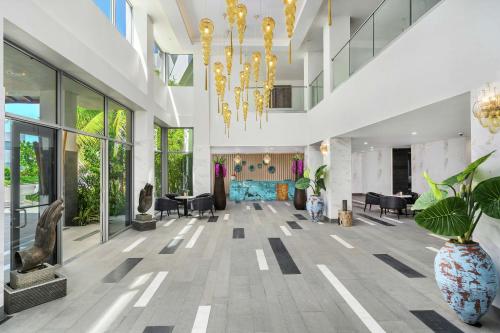 a lobby of a building with a chandelier at Koi Resort Saint Kitts, Curio Collection by Hilton in Basse Terre Town