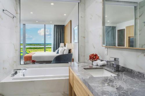  Koi Resort Saint Kitts, Curio Collection by Hilton -  Room  picture :   Tea/Coffee maker    Shower    Safety deposit box                           