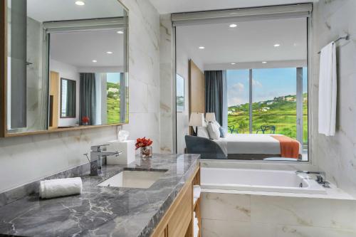  Koi Resort Saint Kitts, Curio Collection by Hilton -  Room  picture :   Tea/Coffee maker    Shower    Safety deposit box                           