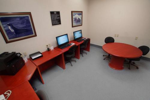 a room with three desks with computers on them at Hampton Inn Tampico Airport in Tampico