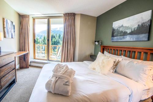 Ein Bett oder Betten in einem Zimmer der Unterkunft Cascade Lodge by Elevate Vacations