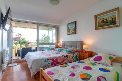A bed or beds in a room at Appartement à Bénodet 3 étoiles avec vue sur mer