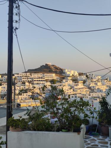 a view of a city with white buildings at Neo-Traditional Sunrise Apartment in Ios Chora