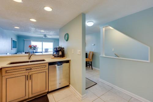 a kitchen with a sink and a counter at Beachfront St Augustine Condo with Pool Access in Saint Augustine