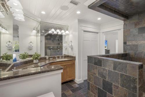 a bathroom with two sinks and a large mirror at Tivoli 5228 G in Destin
