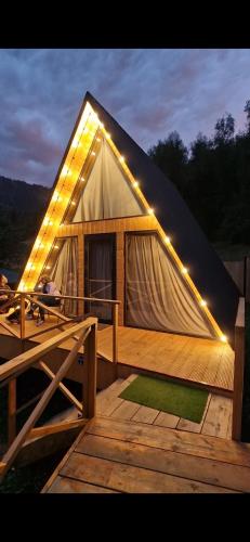 a large tent with lights on the front of it at Eywa House in Kamenskoye Plato