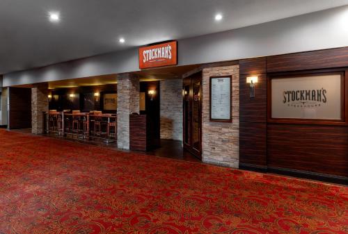 a hotel lobby with a red carpet and a restaurant at The Edgewater Hotel and Casino in Laughlin