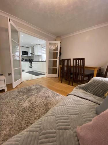 a bedroom with a bed and a dining room with a table at 1 Bedroom property in East London in London