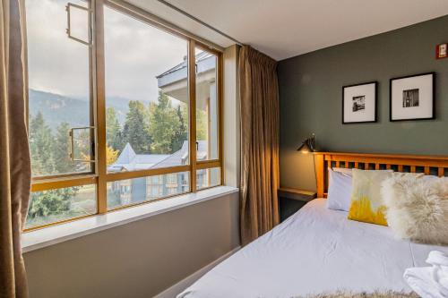 Ein Bett oder Betten in einem Zimmer der Unterkunft Cascade Lodge by Elevate Vacations