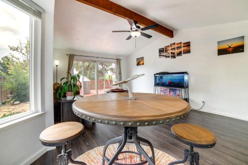 a dining room with a table and two stools at Pet-Friendly Reno Hideaway with Private Hot Tub! in Reno