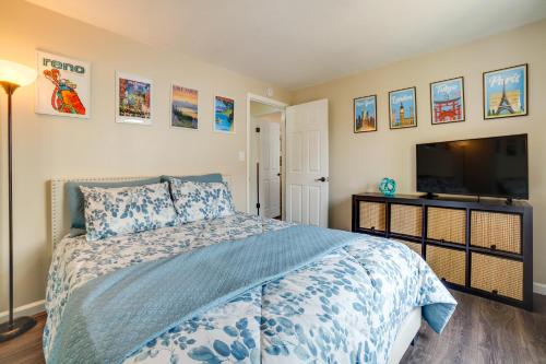 a bedroom with a bed and a flat screen tv at Pet-Friendly Reno Hideaway with Private Hot Tub! in Reno
