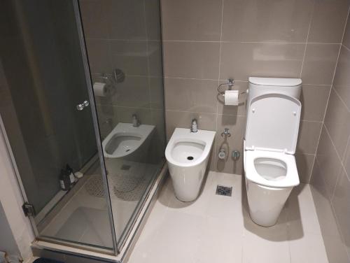 a bathroom with a toilet and a bidet at Zencity in Buenos Aires