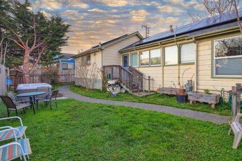 a house with a table and chairs in a yard at Downtown Drift-Hot Tub,Sauna,Bikes,Pet Friendly in Arcata