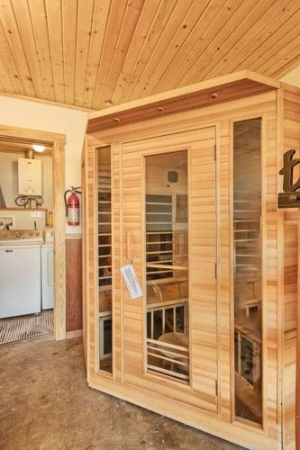 a wooden cabin with a large window in a kitchen at Downtown Drift-Hot Tub,Sauna,Bikes,Pet Friendly in Arcata
