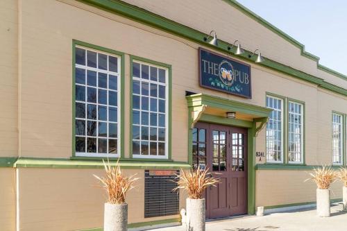 a building with a sign on the front of it at Downtown Drift-Hot Tub,Sauna,Bikes,Pet Friendly in Arcata