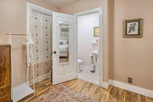 a bathroom with a shower and a toilet at Downtown Drift-Hot Tub,Sauna,Bikes,Pet Friendly in Arcata
