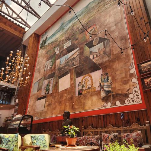 a large painting on the wall of a restaurant at HOTEL CASA BAEZ in Pátzcuaro
