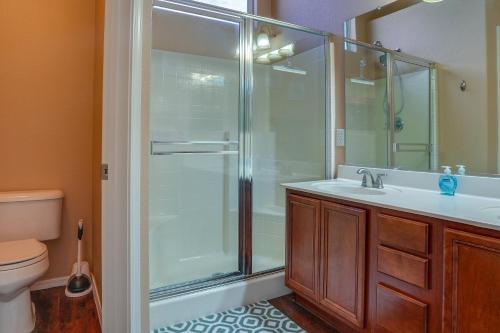 a bathroom with a shower and a sink and a toilet at Bright Peoria Home with Gas Grill and Fire Pit! in Peoria
