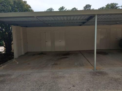 a garage with a roof with four garage stalls at Beautiful Outlook, nr Canberra Hospital @Woden in Phillip