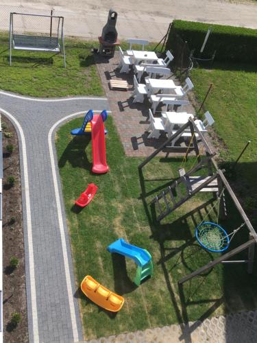 an aerial view of a play park with a playground at Villa Cicha in Karwia