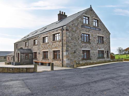 an old stone building with a street in front of it at Six Dorchester Drive - Uk32627 in Inglewhite