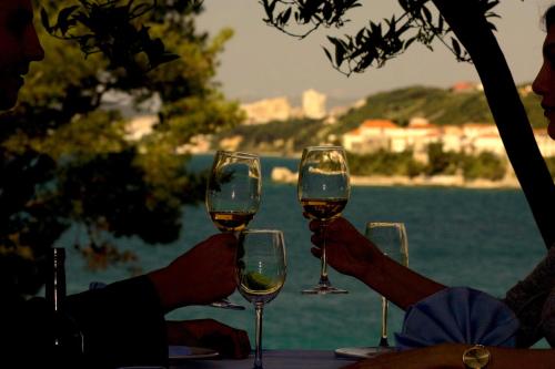 a group of people holding glasses of wine at Hotel Eden in Podstrana