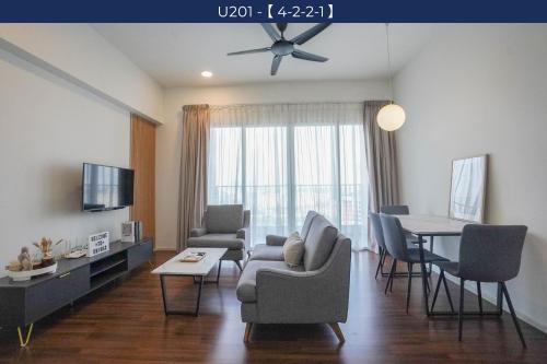 a living room with a couch and a table at UNA Sunway Velocity Kuala Lumpur by Unimax in Kuala Lumpur