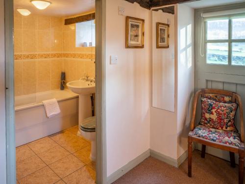 a bathroom with a toilet and a sink and a tub at Foxglove - W43183 in Hawnby