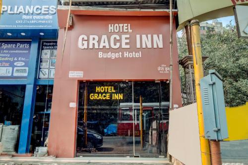 a sign for a hotel garage inn in a city at OYO 67027 Grace Inn in Mumbai